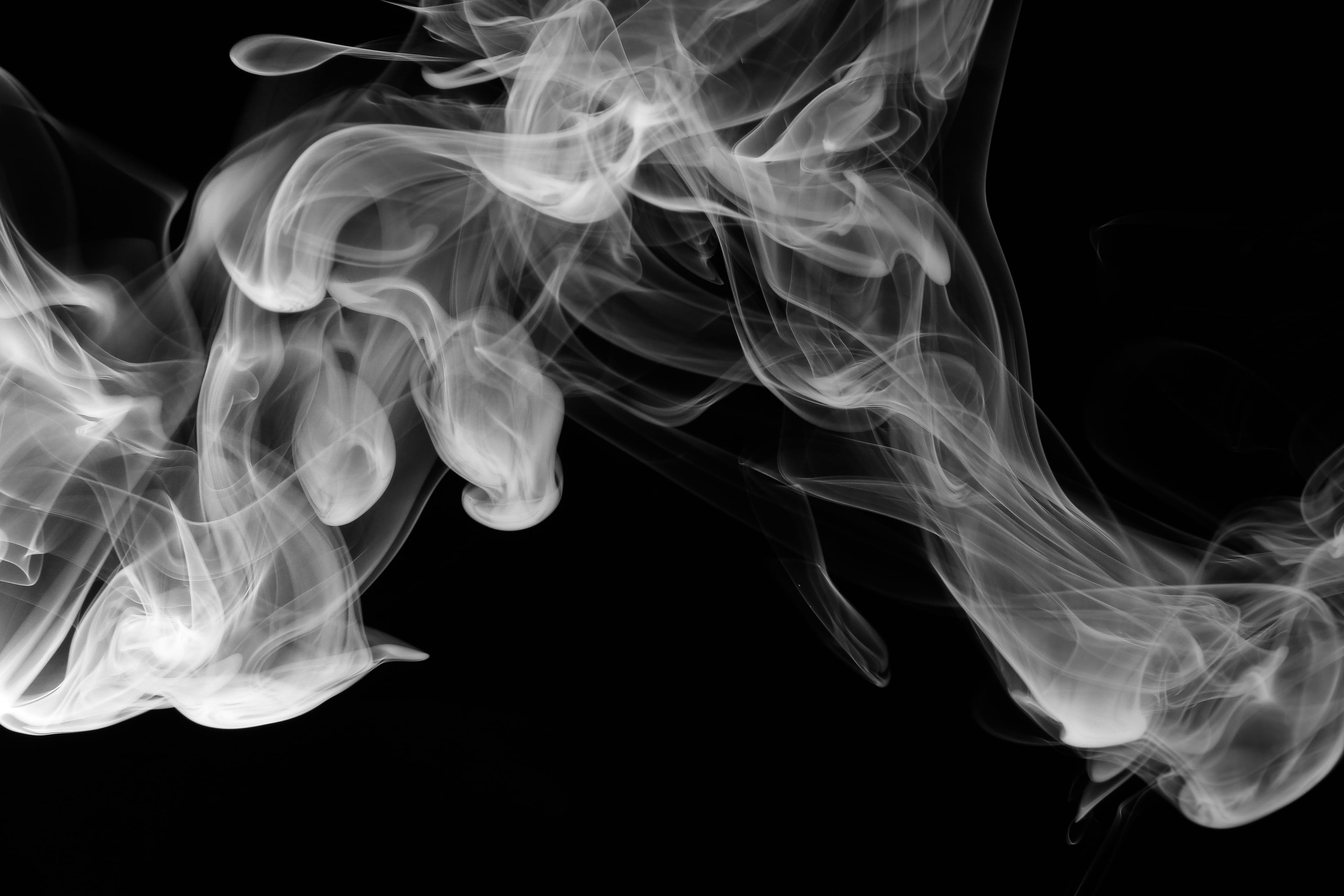 Smoke blowing on dark background